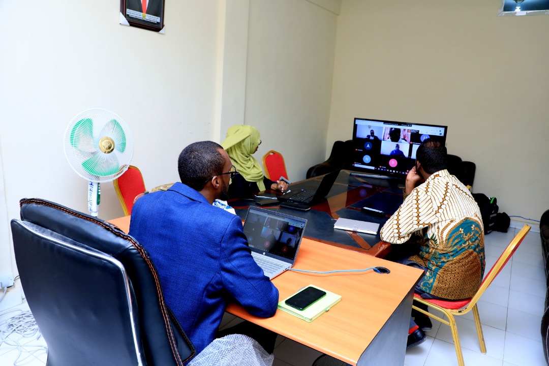 Mukhtar Abdi Omar, Dean, School of Postgraduate Studies and Research (SPGSR), Amoud University (foreground), Saida Abdirahman Omar, Associate Dean, Borama Campus, AUSPGSR(far left) and Zakariye Mohamed Ahmed, Assistant Dean, Borama Campus, AUSPGSR (right), following a live session on a monitor during the online Research Proposal Viva Voce for second year Masters Degree Students held at AUSPGSR, Borama Campus, June 2020 at the peak of covid-19 pandemic upon closure of all learning institutions by the government in order to mitigate negative effects associated with covid-19.